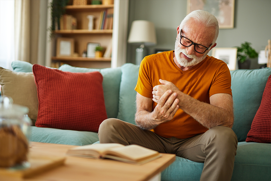 Man holding wrist in pain