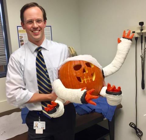 doctor holding pumpkin